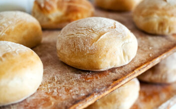 Freshly baked round loaves of white bread